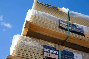 Scyon Stria Splayed Profile cladding boards stacked on a pallet