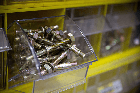 Sleeve anchors and masonry fasteners in a storage bin