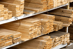 Stacked Radiata Pine dressed timber boards on warehouse racking